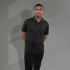 A black eco polo shirt for men with a classic collar and a logo, displayed on a model against a neutral backdrop.