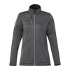 A women's softshell jacket in dark grey, featuring a zip front, high collar, and two side pockets. It has a logo.