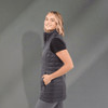 A fitted women's puffer vest in dark grey with a high collar and side pockets. It has a logo on the chest.