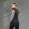 A black women's insulated puffer vest with a fitted silhouette, featuring a high collar and sleek design.