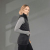 A lightweight packable insulated puffer vest in black, featuring a sleek design and a high neckline.