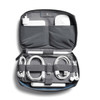 A grey tech kit featuring compartments for a charger, cables, and an airpod case, with a blue interior and a logo.