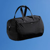 A black duffle bag with two handles and a branded logo, set against a blue background.