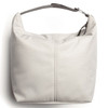 A light grey cooler bag with a handle, featuring a simple design and a logo on the side.