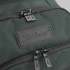 A green backpack featuring two zippered compartments and a branding logo on the front.