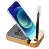 A bamboo phone charging stand holds a smartphone and includes a pen. The design features a fabric base and a logo.