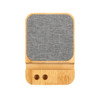 A bamboo eco charger set featuring a textured gray charging pad and a slot for phone placement.