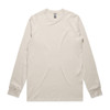 A long sleeve tee in a light beige colour, featuring a logo on the tag. Simple and casual design.