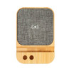 A wireless charger featuring a bamboo base and grey fabric surface, designed for eco-friendly charging.