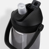 A drink bottle made of grey plastic with a black cap and handle, featuring a flip straw and a logo.