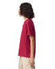 A side view of a youth T-shirt in burgundy, featuring short sleeves and a simple design with a logo.
