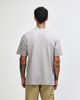 A grey American Apparel Super Heavyweight T-Shirt seen from the back, featuring a simple design and loose fit.