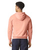 A lightweight hooded sweatshirt in a soft peach colour, featuring a hood and a simple design.