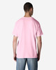 A man wearing a pink Gildan Light Cotton T-Shirt from the back, paired with denim jeans.