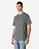 A grey Gildan Light Cotton T-Shirt on a male model, with a simple design and relaxed fit.