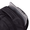 A black backpack with multiple zippered compartments, featuring a grey laptop partially stored inside.
