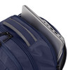 A navy backpack with a laptop partially visible inside, featuring multiple zippered compartments and a logo.