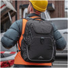 A sturdy, black High Sierra Access 4.0 backpack, worn by a worker in an orange vest and hard hat.