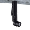 A black FlexLight Torch with an adjustable head and a clip for attachment, designed for portable lighting.