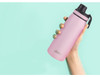 A drink bottle in a sleek pink colour, featuring a screw cap and a brand logo.