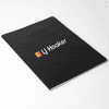 A black Velour DuPont A5 notebook with a textured cover and a logo on the front.