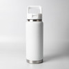 A drink bottle in matte white with a stainless steel base and a handle for easy carrying.