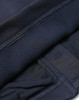 A navy blue men's sustainable softshell jacket featuring smooth fabric and a soft inner lining. The jacket includes a logo.