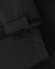 A close-up of a black unisex quilted waterproof jacket featuring a Velcro cuff and smooth fabric texture.