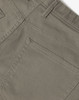 A close-up of men's flexi chino pants in a light brown colour, featuring a back pocket and stitched detailing.