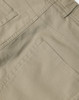 A close-up of khaki ladies' chino pants showcasing detailed stitching and pocket design. The pants have branding present.