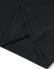 A close-up of a black premium cotton t-shirt, highlighting the fabric and stitching details.
