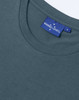 A women's short sleeve tee shirt in dark grey with a round neckline and a branded label.