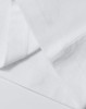 A white cotton tee with detailed stitching, featuring a relaxed fit and short sleeves. It has a logo.