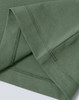 A green ladies' premium cotton short-sleeve tee shirt, featuring neat stitching at the sleeves. There is a logo present.