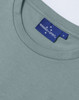 A light green ladies' premium cotton short-sleeve tee shirt featuring a label with a logo.