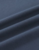 A close-up of dark navy blue cotton fabric, showcasing its smooth texture and folds.