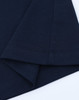 A navy blue long-sleeve cotton tee shirt featuring a hemmed finish and a logo on the sleeve.