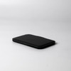 A black pocket mirror with a slim, rectangular design, featuring a soft-touch finish and minimalistic look.