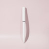 A white ballpoint pen with a sleek design and mirror finish, set against a soft pink background.