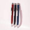 Three ballpoint pens in red, black, and blue, featuring shiny silver accents and a sleek design.