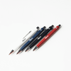 A collection of metal pens in red, white, navy, and black, featuring a logo on each pen.