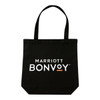 A black tote bag with two handles and a logo featured prominently on the front.