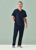 A unisex pulse V-neck scrub top in navy blue worn with matching scrub pants, featuring a logo.