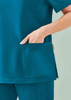A women's teal V-neck scrub top featuring a side pocket, designed for comfort and utility in uniform apparel.