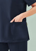A navy women's scrub top featuring a side pocket and short sleeves. The fabric is smooth and durable.