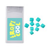 A rectangular package of mints in white, with several turquoise square mints scattered beside it. The package has a logo.
