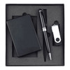 A black power bank, USB drive, and pen arranged in a black gift box. The set is neatly positioned on grey foam.