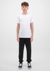 A pair of black track pants for youth, paired with a plain white t-shirt and black shoes.