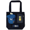 A navy tote bag holds a blue cap, a pineapple notebook, a pen, and a drink bottle, all featuring a logo.