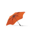 An orange BLUNT Metro Umbrella with a sleek design and a sturdy black frame. It features a logo on the fabric.
